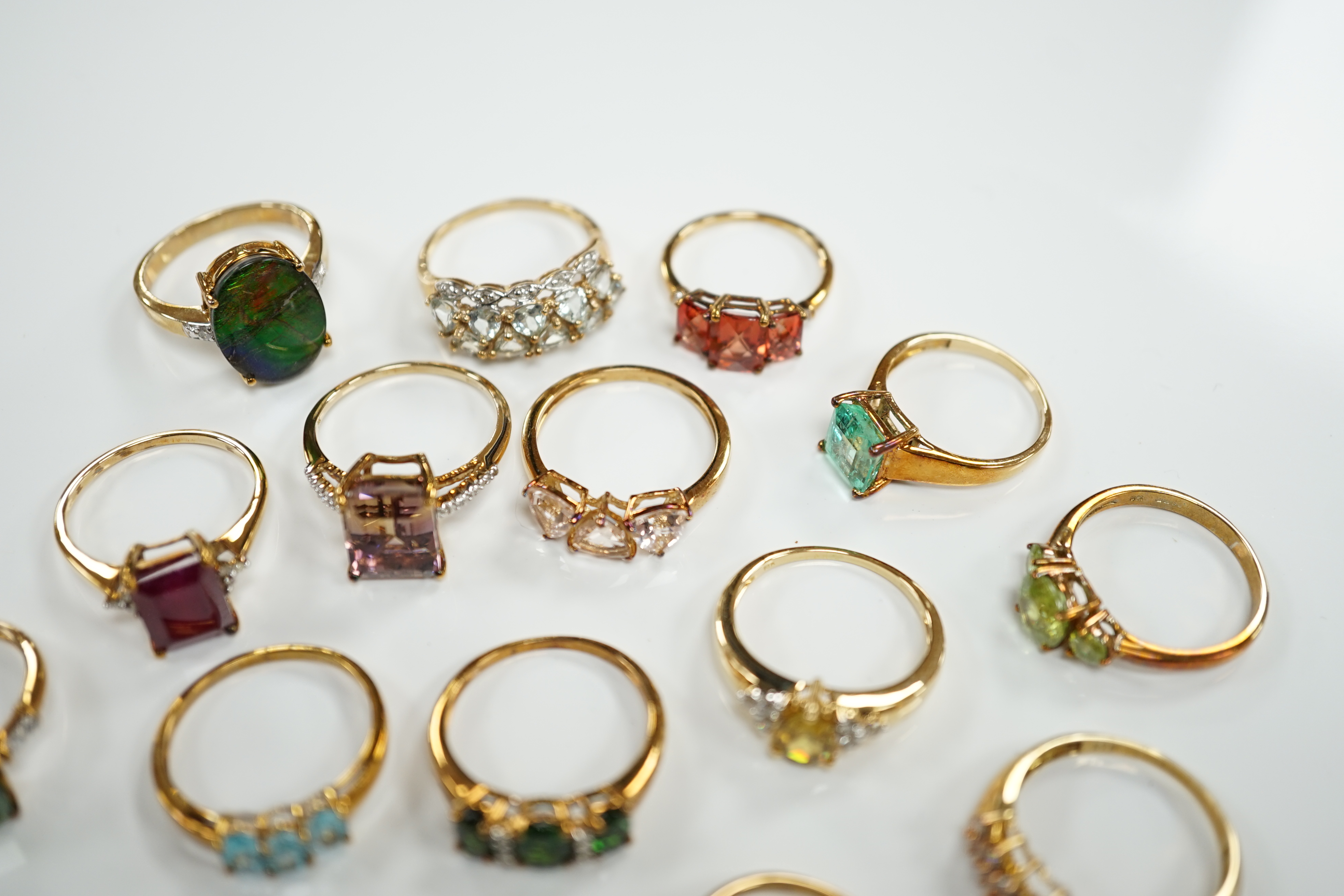Thirteen assorted modern 9ct gold of 9k and gem set dress rings and a 9ct gold and gem set pendant, gross weight 40.2 grams, together with an 18ct gold, gem and diamond chip set target pendant and an 18ct gold and gem se